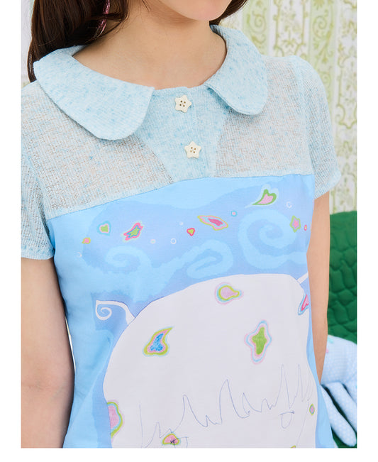 Front view of UnsocialNight Momoko blue girl knit top featuring short puff sleeves, a buttoned neckline, and a vintage graphic print patchwork on premium breathable cotton.