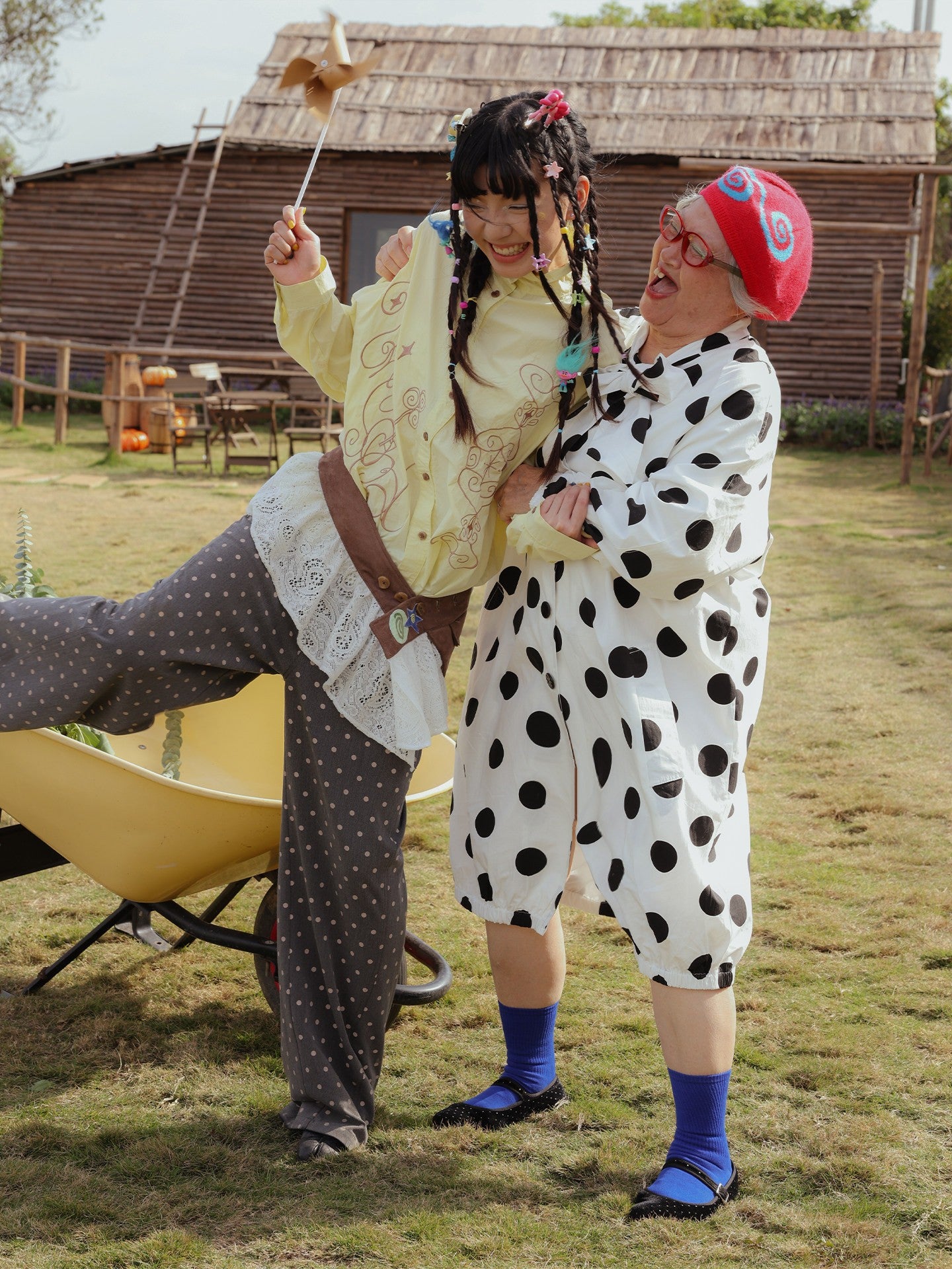Front view of Unsocial Night oversized vintage polka dot trench coat showcasing the relaxed longline silhouette, classic button closure, and timeless dot pattern