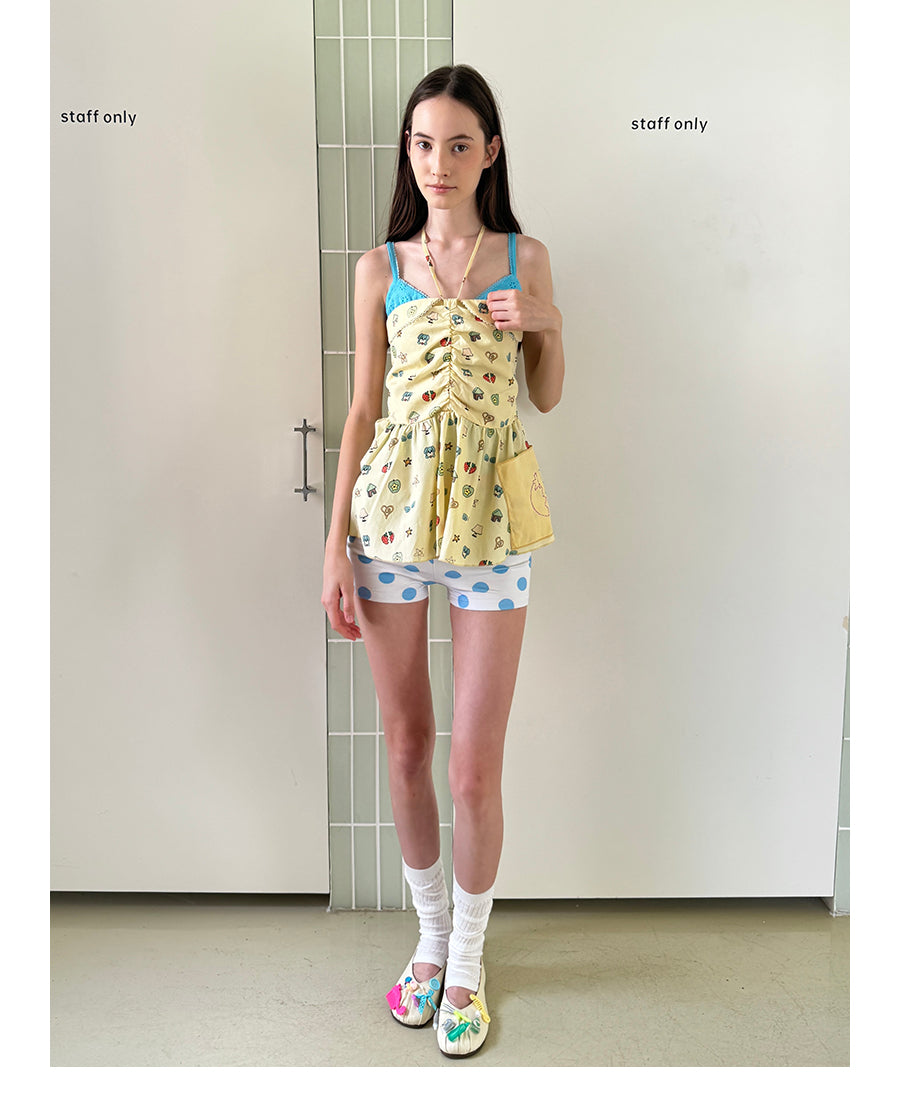 Unsocial Night strapless tube top showcasing a whimsical naive-art illustration print, central front detailing, and adjustable ribbon halter ties