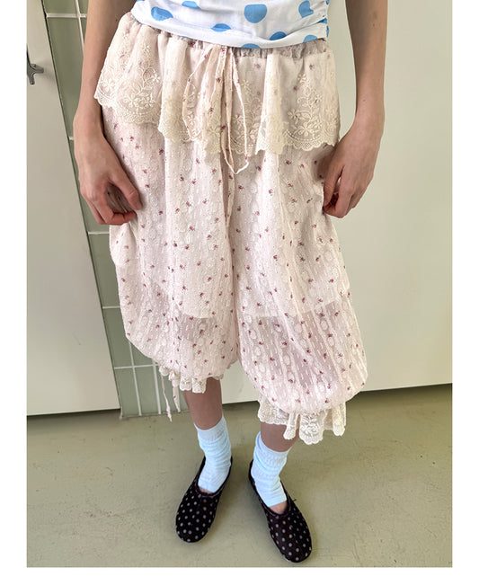 Unsocial Night Capri trousers showcasing the delicate lace trim inserts, central ruched leg detailing, adjustable ribbon ties, and functional drawstring hems