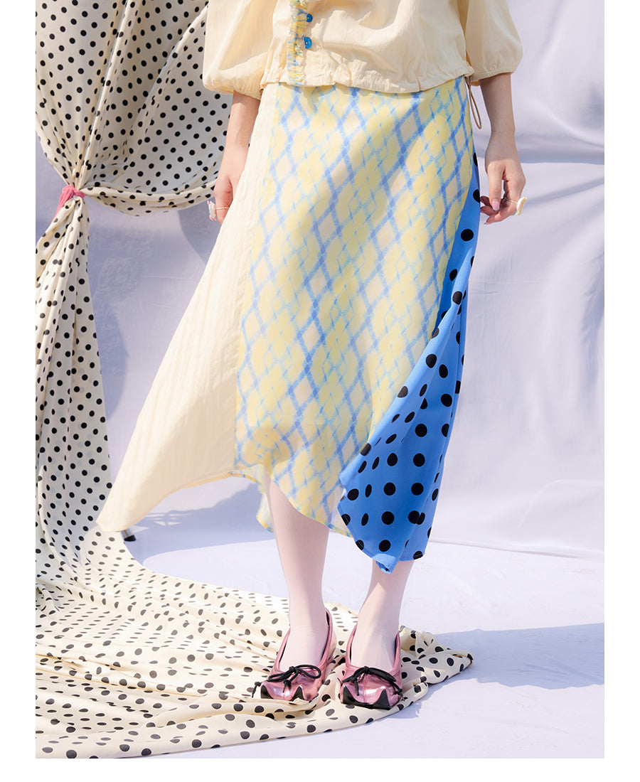 Front view of Unsocial Night Scrapbook Sunday patchwork skirt featuring a mid-rise A-line flare silhouette, contrast paneling, plaid and polka dots patchwork
