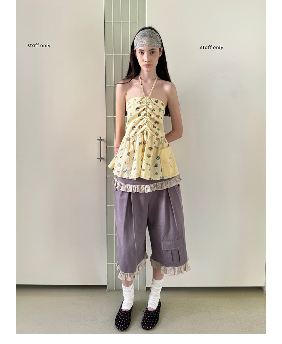 Unsocial Night strapless tube top showcasing a whimsical naive-art illustration print, central front detailing, and adjustable ribbon halter ties