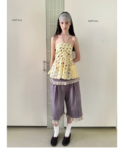 Unsocial Night strapless tube top showcasing a whimsical naive-art illustration print, central front detailing, and adjustable ribbon halter ties