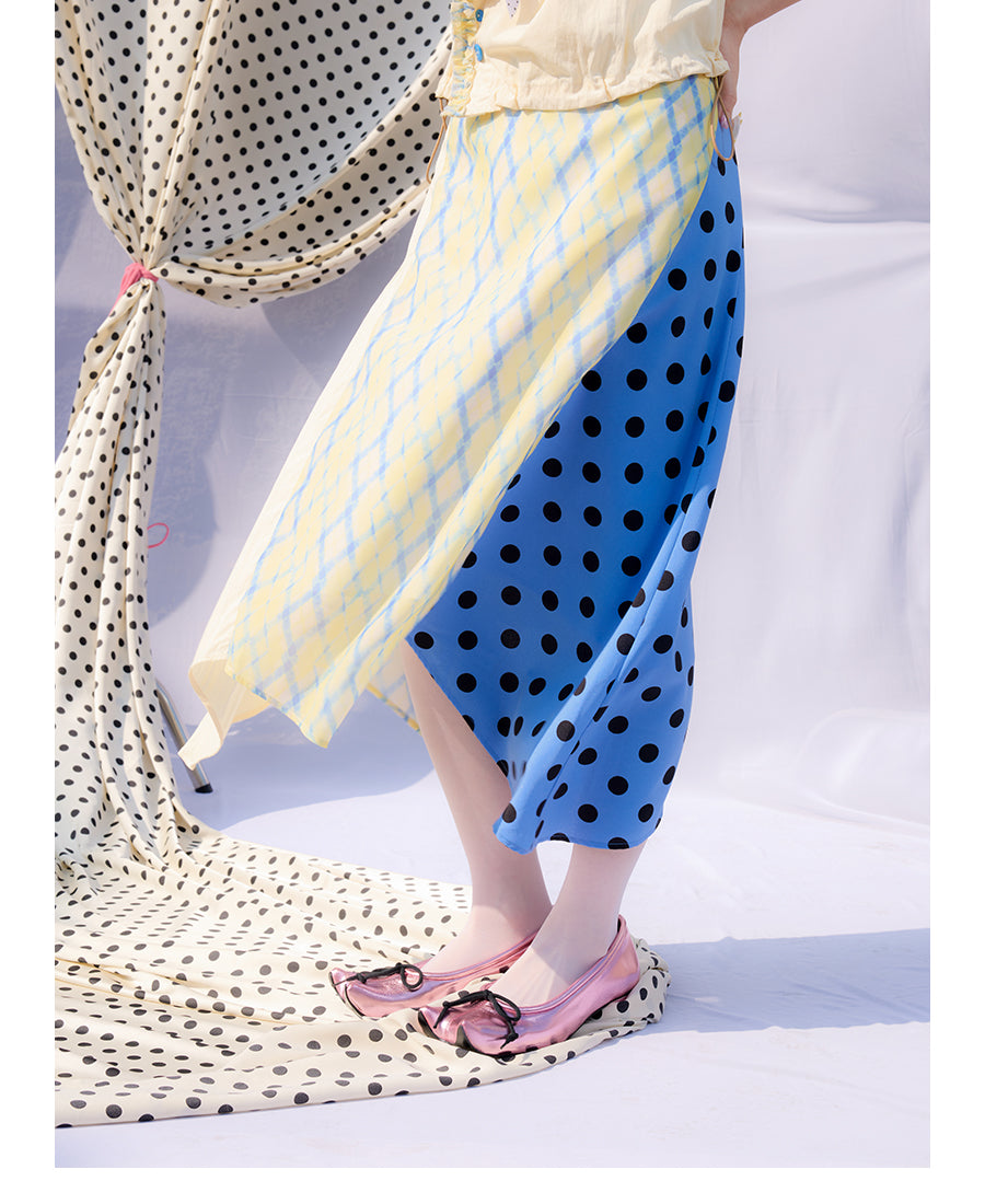 Front view of Unsocial Night Scrapbook Sunday patchwork skirt featuring a mid-rise A-line flare silhouette, contrast paneling, plaid and polka dots patchwork