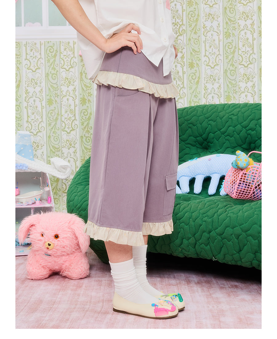 Front view of Unsocial Night purple star lace patchwork capri pants featuring a relaxed loose-fit silhouette, natural waist, and zipper fly closure in a cotton-linen fabric.