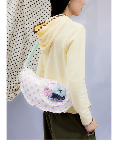 Front view of Unsocial Night Oliwa USN Girls Club pillow bag showcasing the custom artist painting print on a soft quilted padded shoulder bag silhouette