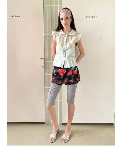 Unsocial Night short sleeve shirt showcasing the sheer mesh panel inserts, central button closures, slim-fit tailoring, and structural flutter sleeves