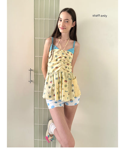 Unsocial Night strapless tube top showcasing a whimsical naive-art illustration print, central front detailing, and adjustable ribbon halter ties