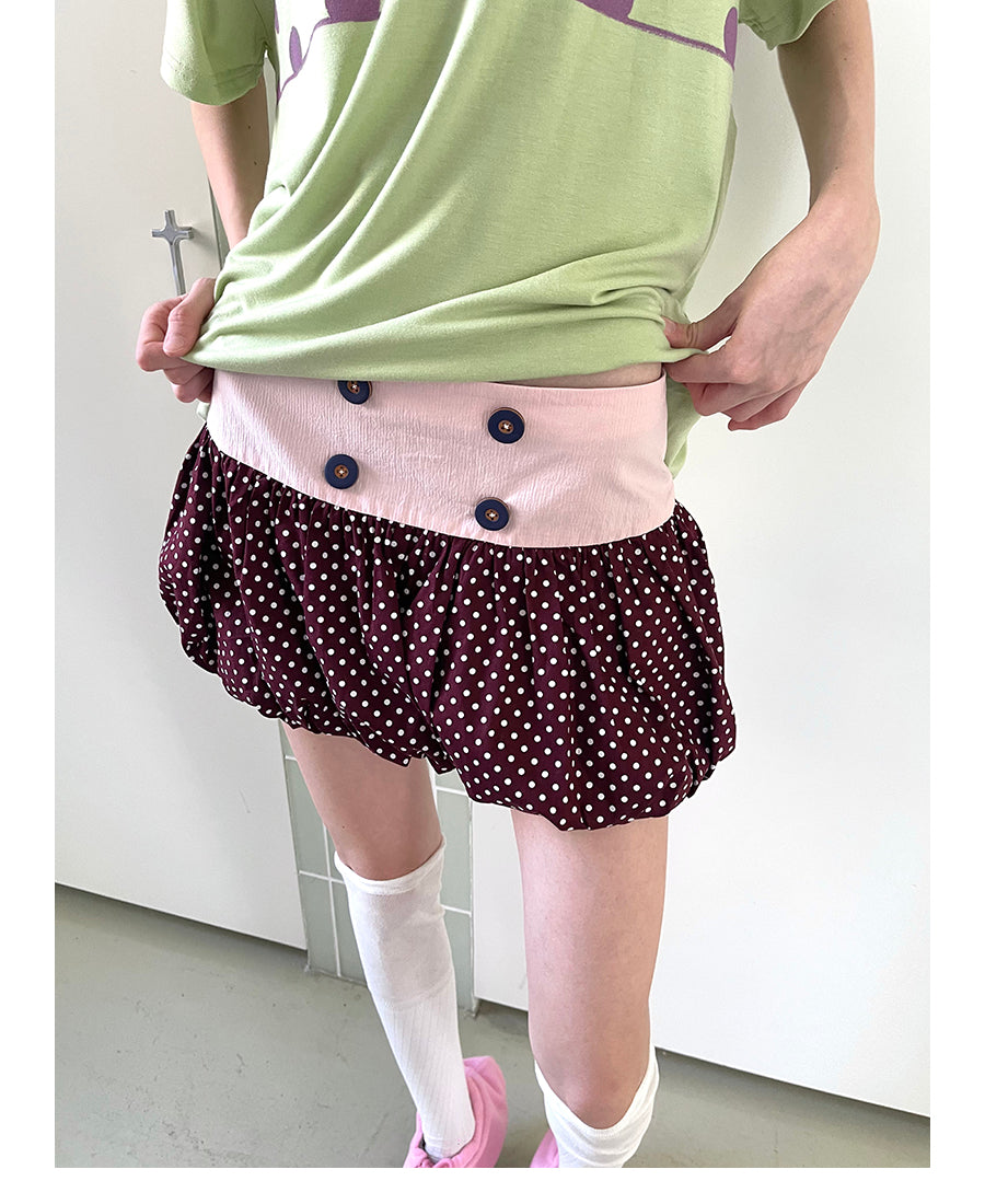 Unsocial Night bubble puff skort showcasing a whimsical polka dot print, contrast patchwork detailing, structured voluminous hem, and internal shorts