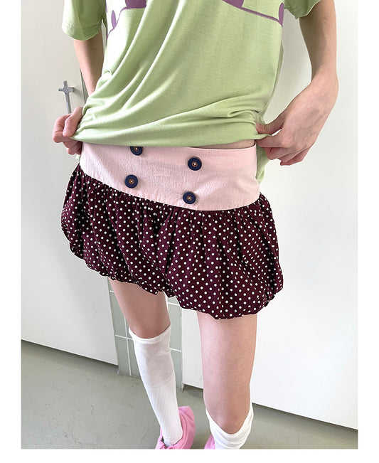 Unsocial Night bubble puff skort showcasing a whimsical polka dot print, contrast patchwork detailing, structured voluminous hem, and internal shorts