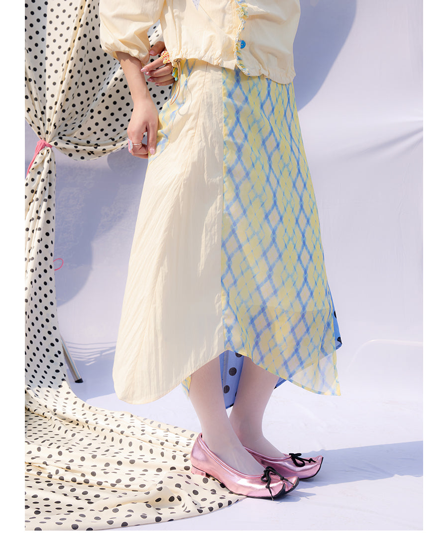 Front view of Unsocial Night Scrapbook Sunday patchwork skirt featuring a mid-rise A-line flare silhouette, contrast paneling, plaid and polka dots patchwork