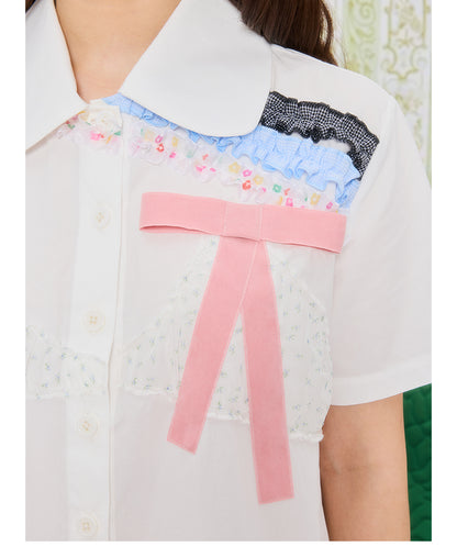 Front view of Unsocial Night white bikini-inspired lace trim shirt featuring a straight silhouette, regular short sleeves, a Peter Pan collar, and button closure