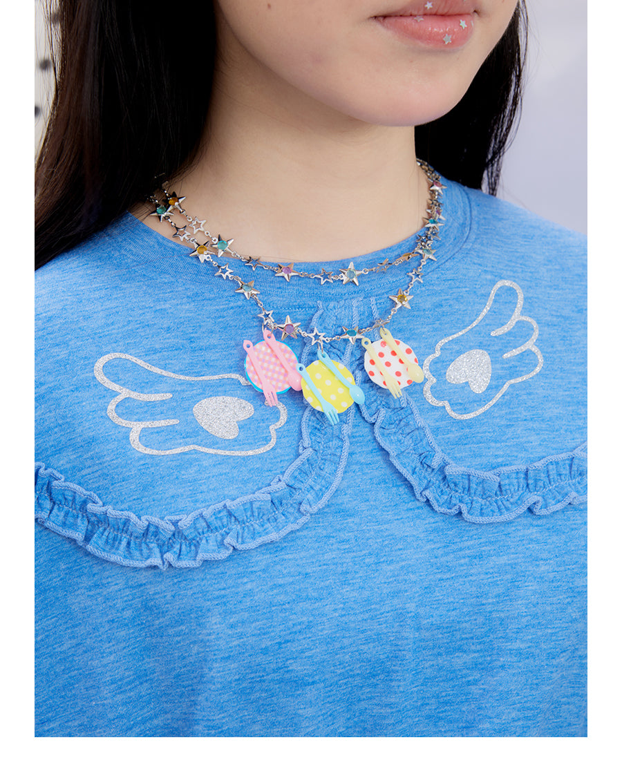 Front view of Unsocial Night blue ruffles tee top featuring a relaxed oversized silhouette, a classic crewneck, long sleeves, and paneled patchwork detailing