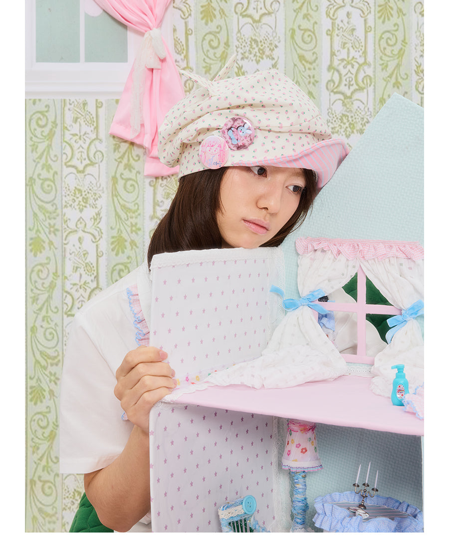 Front view of Unsocial Night strawberry striped cat ear beanie featuring a pleated slouched slouchy shape, a soft brim, and non-adjustable cotton knit texture.