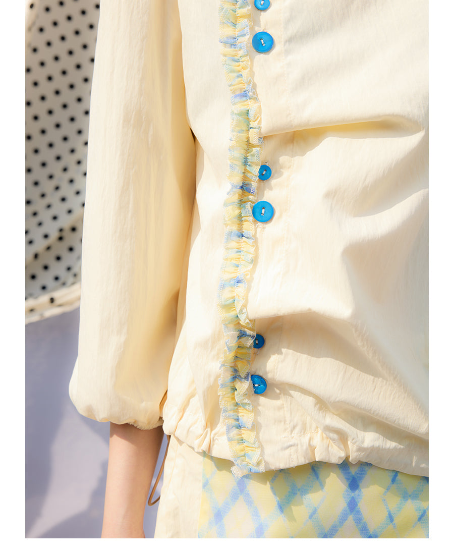 Front view of Unsocial Night pale yellow Wrapped in Lemon Souffle shirt featuring a soft regular fit, short sleeves, split neck with ponytail ties, and panel stitching