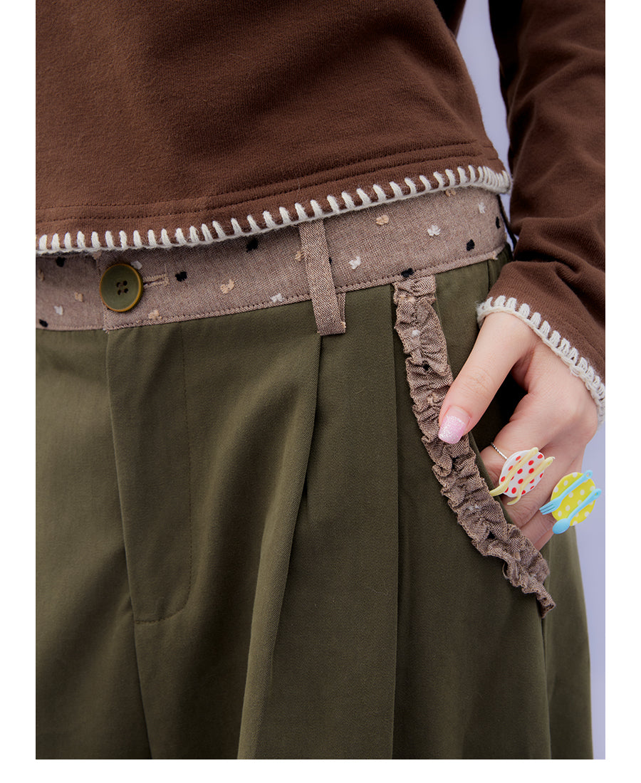 Front view of Unsocial Night moss green cargo pants featuring a paperbag waist silhouette, utility pockets, zipper fly, and textured cotton-linen fabric