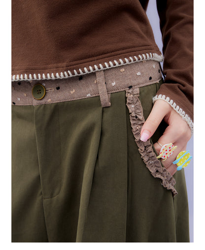 Front view of Unsocial Night moss green cargo pants featuring a paperbag waist silhouette, utility pockets, zipper fly, and textured cotton-linen fabric