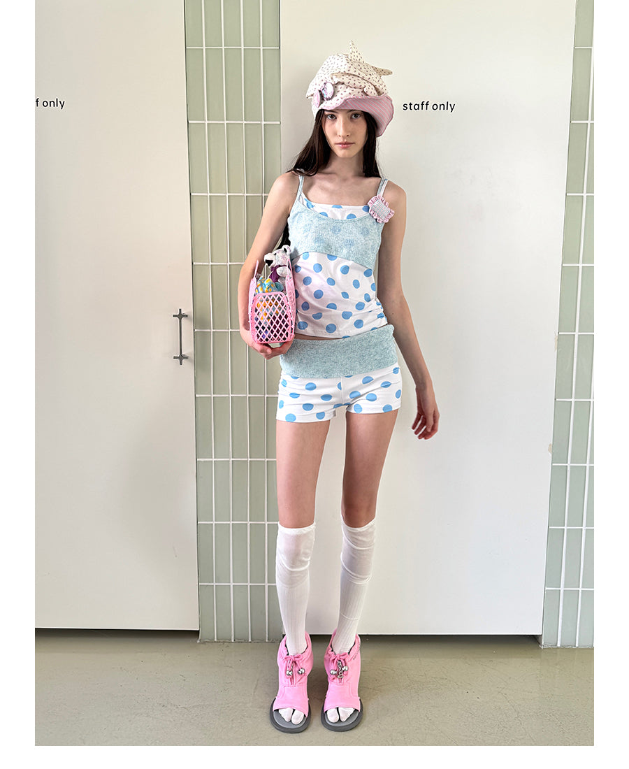 Unsocial Night knitted 2-piece set showcasing a whimsical polka dot print, contrast knit patchwork tailoring, camisole straps, and elasticated shorts