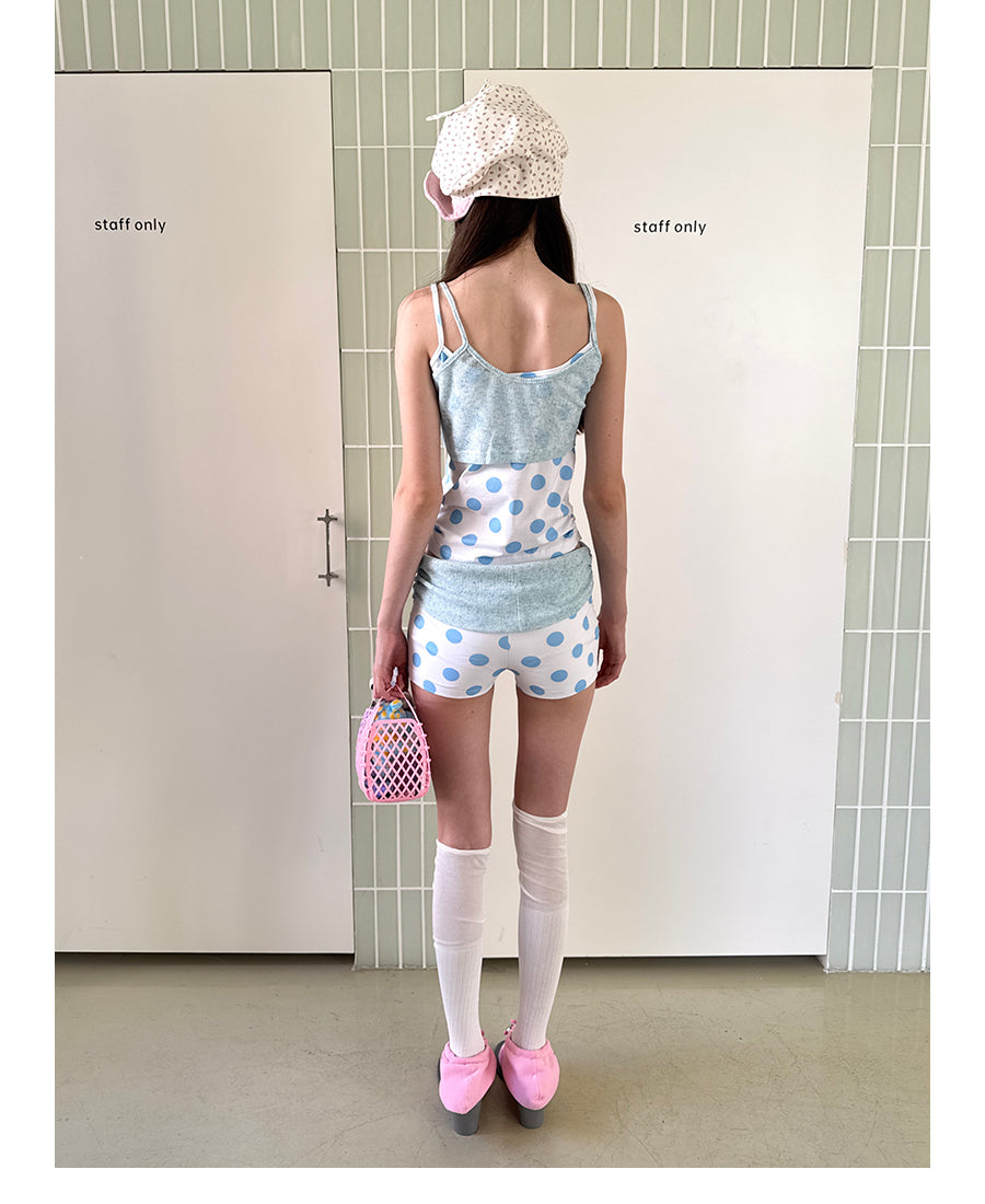 Unsocial Night knitted 2-piece set showcasing a whimsical polka dot print, contrast knit patchwork tailoring, camisole straps, and elasticated shorts