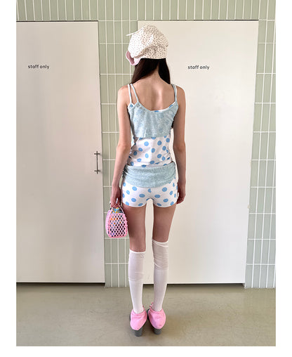 Unsocial Night knitted 2-piece set showcasing a whimsical polka dot print, contrast knit patchwork tailoring, camisole straps, and elasticated shorts