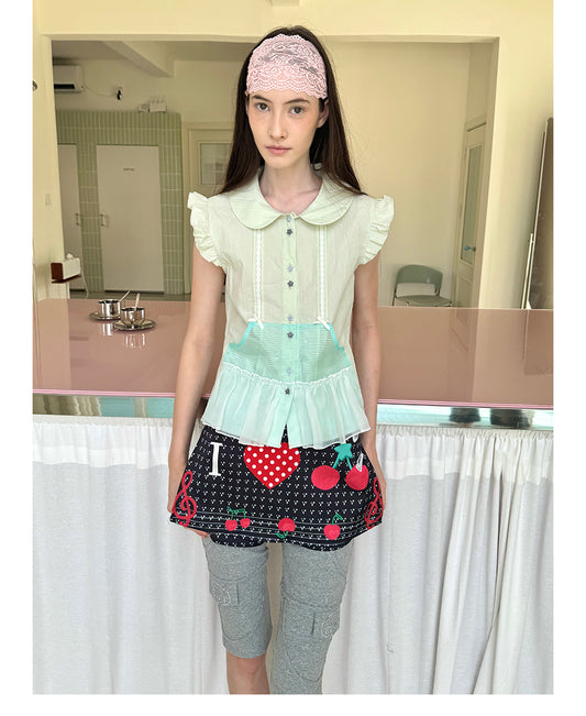 Unsocial Night short sleeve shirt showcasing the sheer mesh panel inserts, central button closures, slim-fit tailoring, and structural flutter sleeves