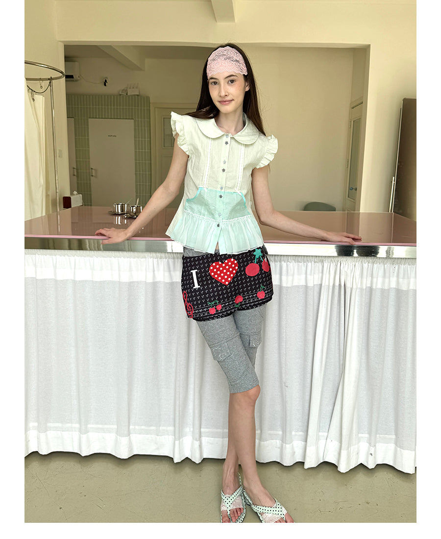 Unsocial Night fitted biker shorts showcasing the contrast patchwork seams, slim-fit technical fabric, and custom sparkling rhinestone details