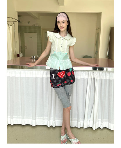 Unsocial Night fitted biker shorts showcasing the contrast patchwork seams, slim-fit technical fabric, and custom sparkling rhinestone details