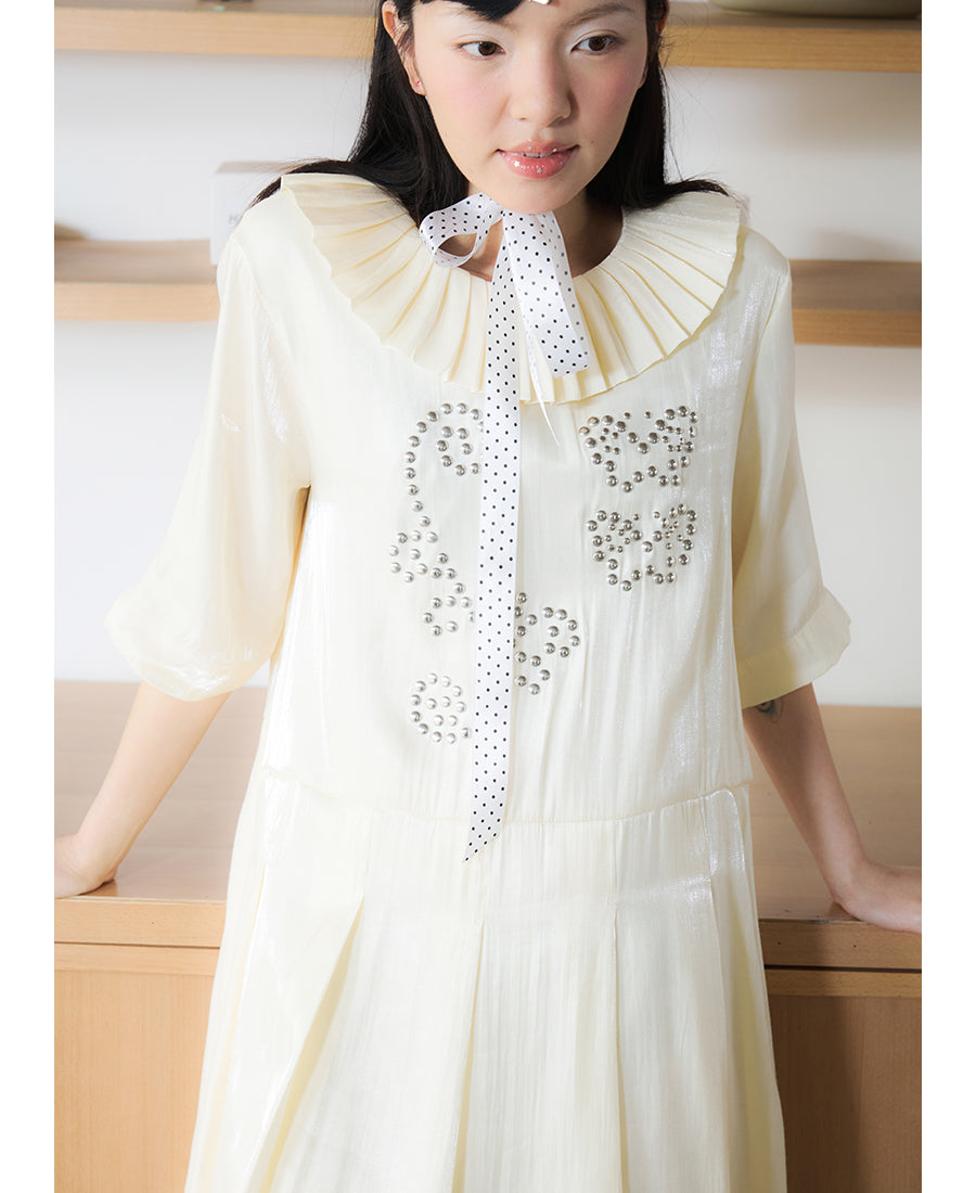 Front view of Unsocial Night beige Shimmer Waves pleated dress featuring an A-line silhouette, classic round neck, half sleeves, and delicate rhinestone embellishments