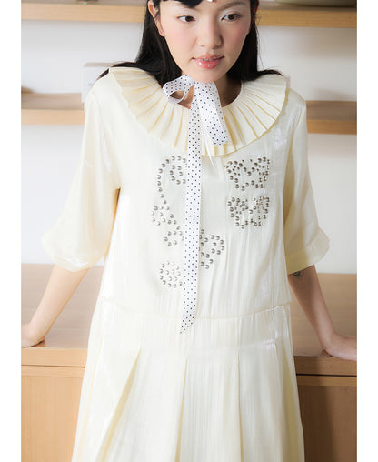 Front view of Unsocial Night beige Shimmer Waves pleated dress featuring an A-line silhouette, classic round neck, half sleeves, and delicate rhinestone embellishments