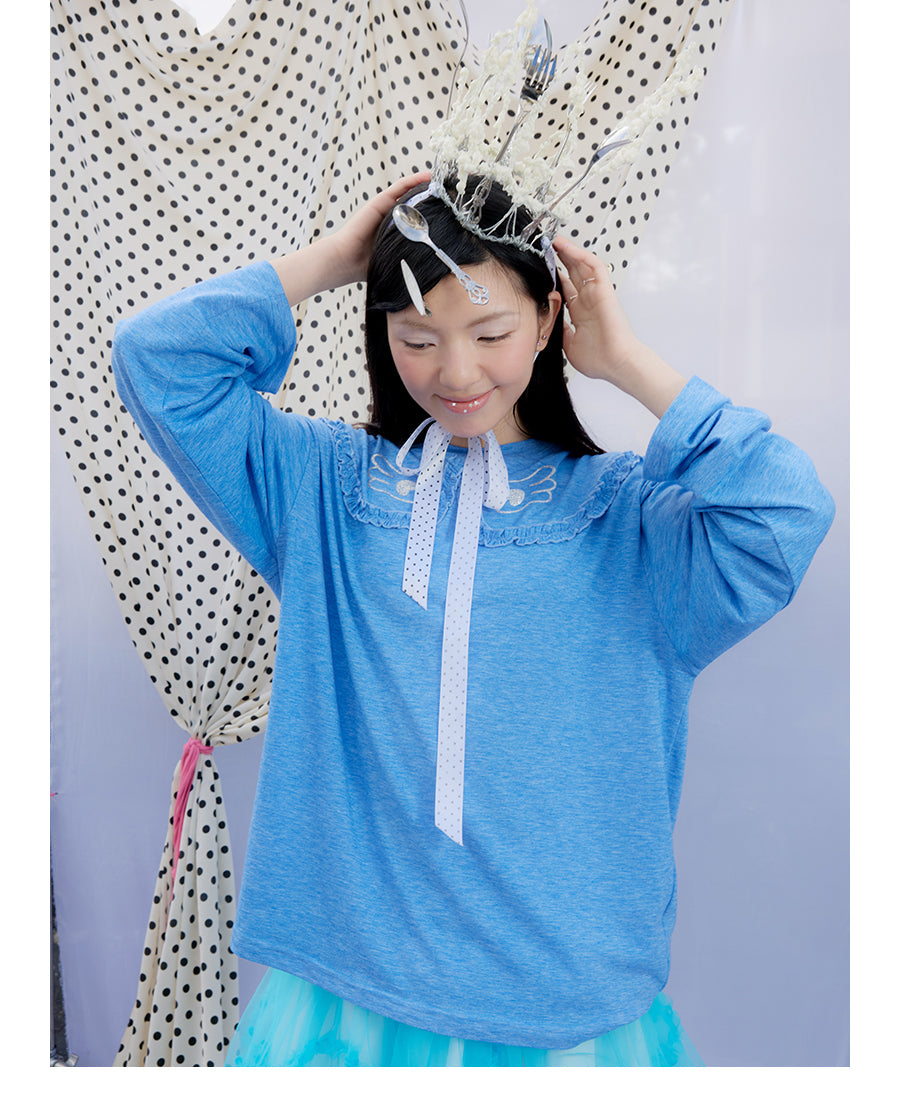 Front view of Unsocial Night blue ruffles tee top featuring a relaxed oversized silhouette, a classic crewneck, long sleeves, and paneled patchwork detailing