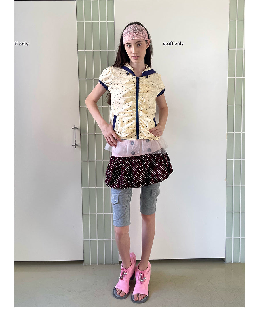 Unsocial Night bubble puff skort showcasing a whimsical polka dot print, contrast patchwork detailing, structured voluminous hem, and internal shorts