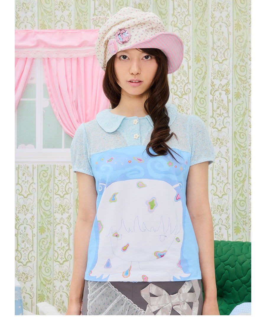 Front view of UnsocialNight Momoko blue girl knit top featuring short puff sleeves, a buttoned neckline, and a vintage graphic print patchwork on premium breathable cotton.
