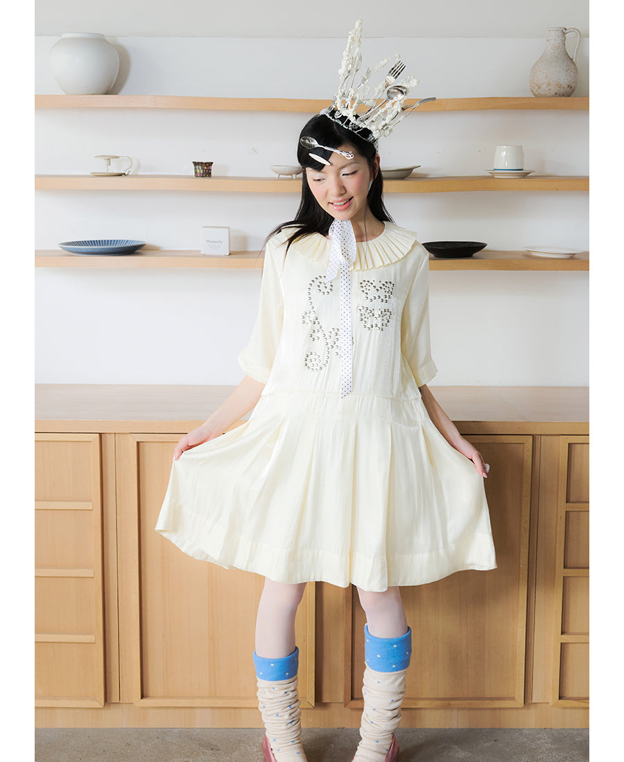 Front view of Unsocial Night beige Shimmer Waves pleated dress featuring an A-line silhouette, classic round neck, half sleeves, and delicate rhinestone embellishments