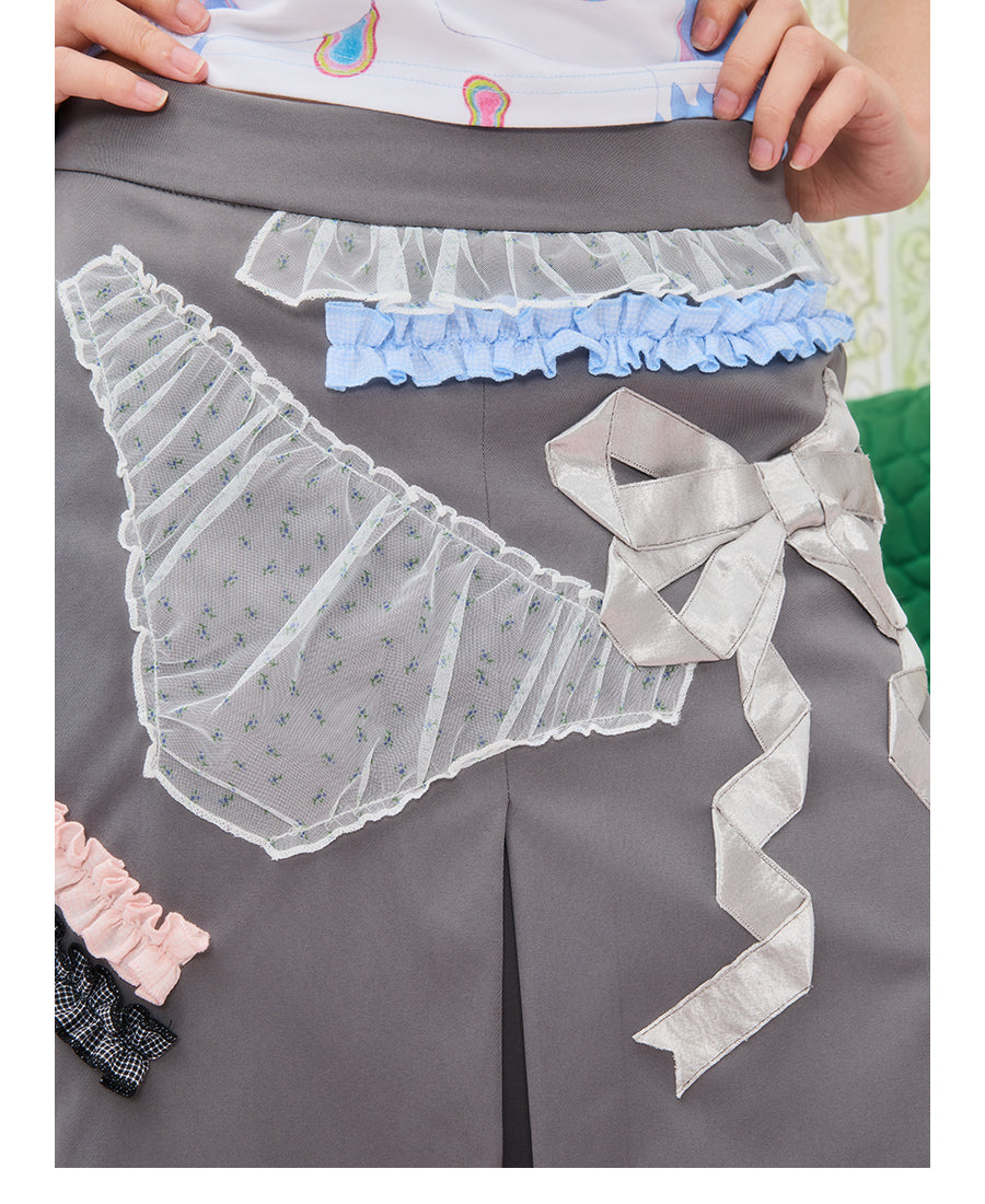 Front view of Unsocial Night grey coquette lace trim pleated skirt featuring a mid-rise A-line flare silhouette, a side zipper, and a fully lined design.