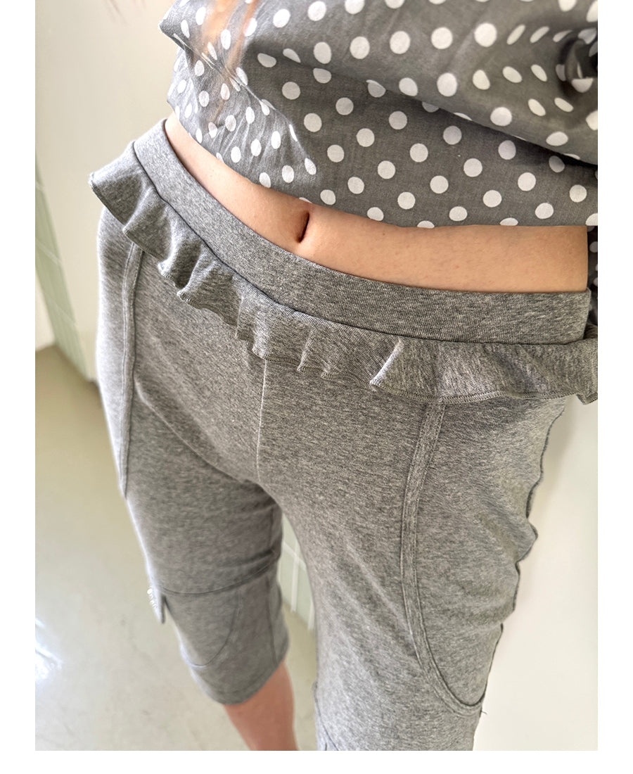 Unsocial Night fitted biker shorts showcasing the contrast patchwork seams, slim-fit technical fabric, and custom sparkling rhinestone details