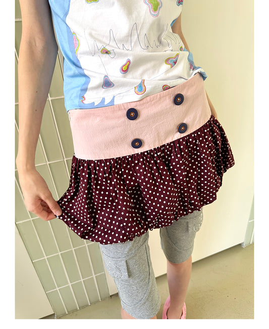 Unsocial Night bubble puff skort showcasing a whimsical polka dot print, contrast patchwork detailing, structured voluminous hem, and internal shorts