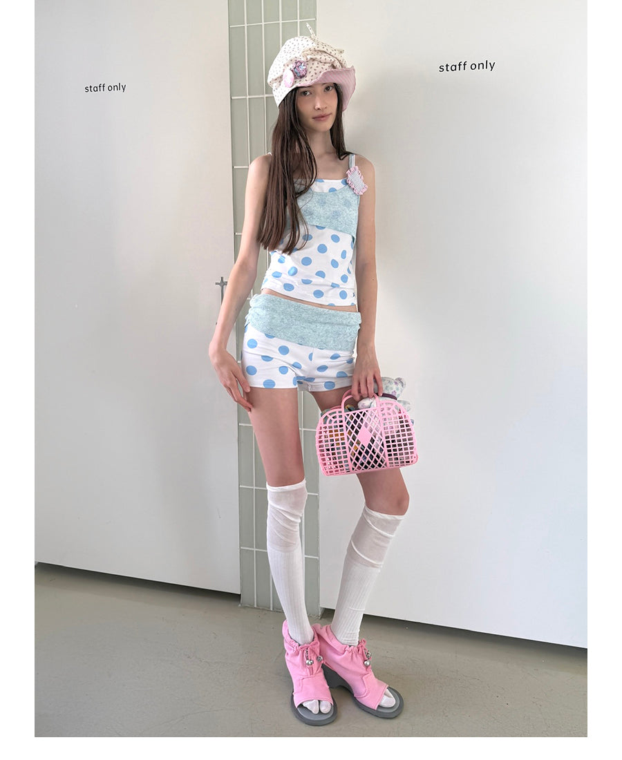 Unsocial Night knitted 2-piece set showcasing a whimsical polka dot print, contrast knit patchwork tailoring, camisole straps, and elasticated shorts