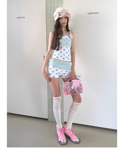Unsocial Night knitted 2-piece set showcasing a whimsical polka dot print, contrast knit patchwork tailoring, camisole straps, and elasticated shorts