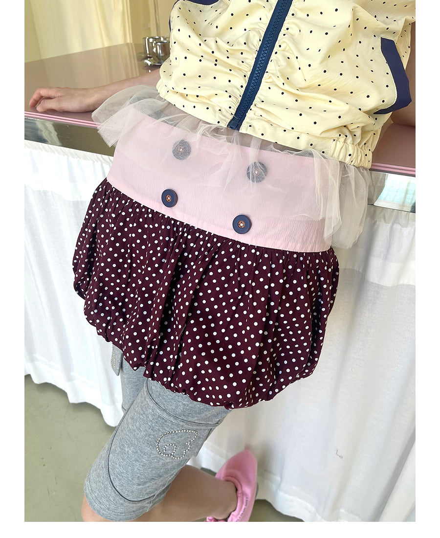 Unsocial Night bubble puff skort showcasing a whimsical polka dot print, contrast patchwork detailing, structured voluminous hem, and internal shorts