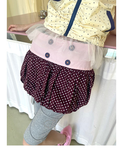 Unsocial Night bubble puff skort showcasing a whimsical polka dot print, contrast patchwork detailing, structured voluminous hem, and internal shorts