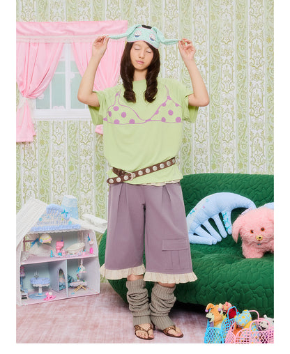 Front view of Unsocial Night's original oversized white T-shirt featuring a detailed trompe parody bikini graphic print