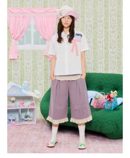 Front view of Unsocial Night purple star lace patchwork capri pants featuring a relaxed loose-fit silhouette, natural waist, and zipper fly closure in a cotton-linen fabric.