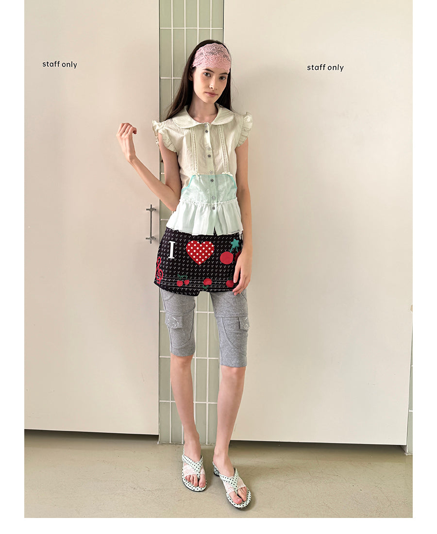 Unsocial Night fitted biker shorts showcasing the contrast patchwork seams, slim-fit technical fabric, and custom sparkling rhinestone details