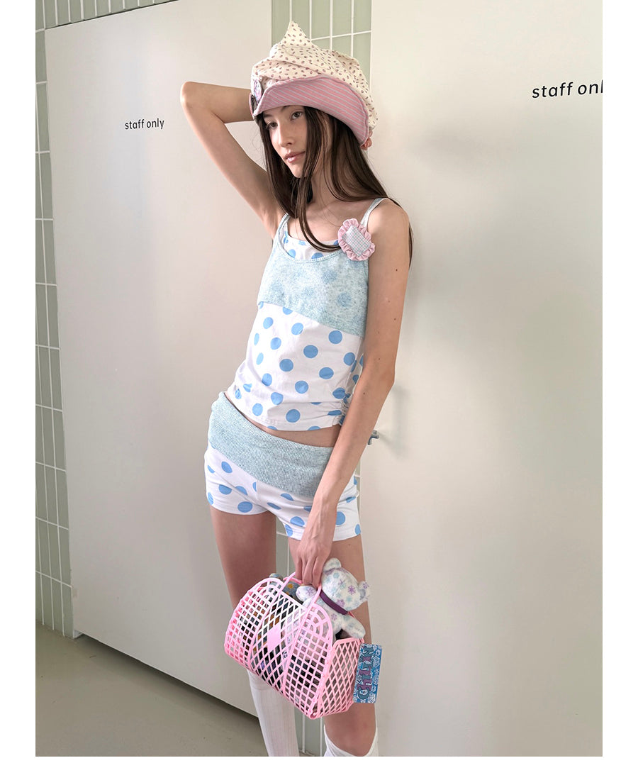 Unsocial Night knitted 2-piece set showcasing a whimsical polka dot print, contrast knit patchwork tailoring, camisole straps, and elasticated shorts
