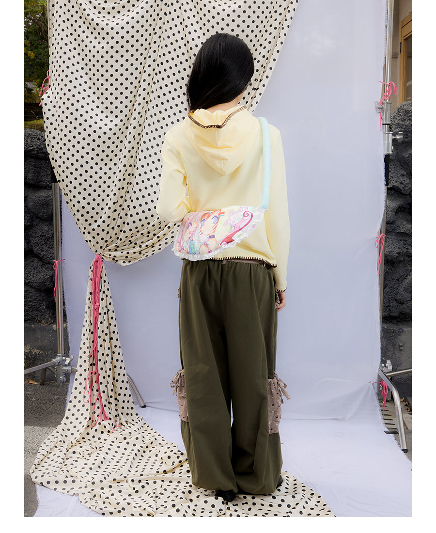 Front view of Unsocial Night moss green cargo pants featuring a paperbag waist silhouette, utility pockets, zipper fly, and textured cotton-linen fabric