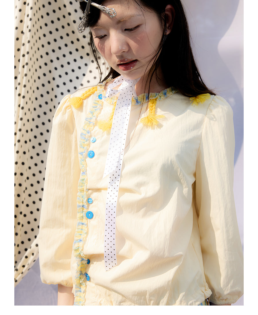 Front view of Unsocial Night pale yellow Wrapped in Lemon Souffle shirt featuring a soft regular fit, short sleeves, split neck with ponytail ties, and panel stitching