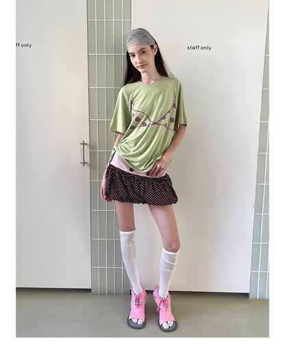 Unsocial Night bubble puff skort showcasing a whimsical polka dot print, contrast patchwork detailing, structured voluminous hem, and internal shorts