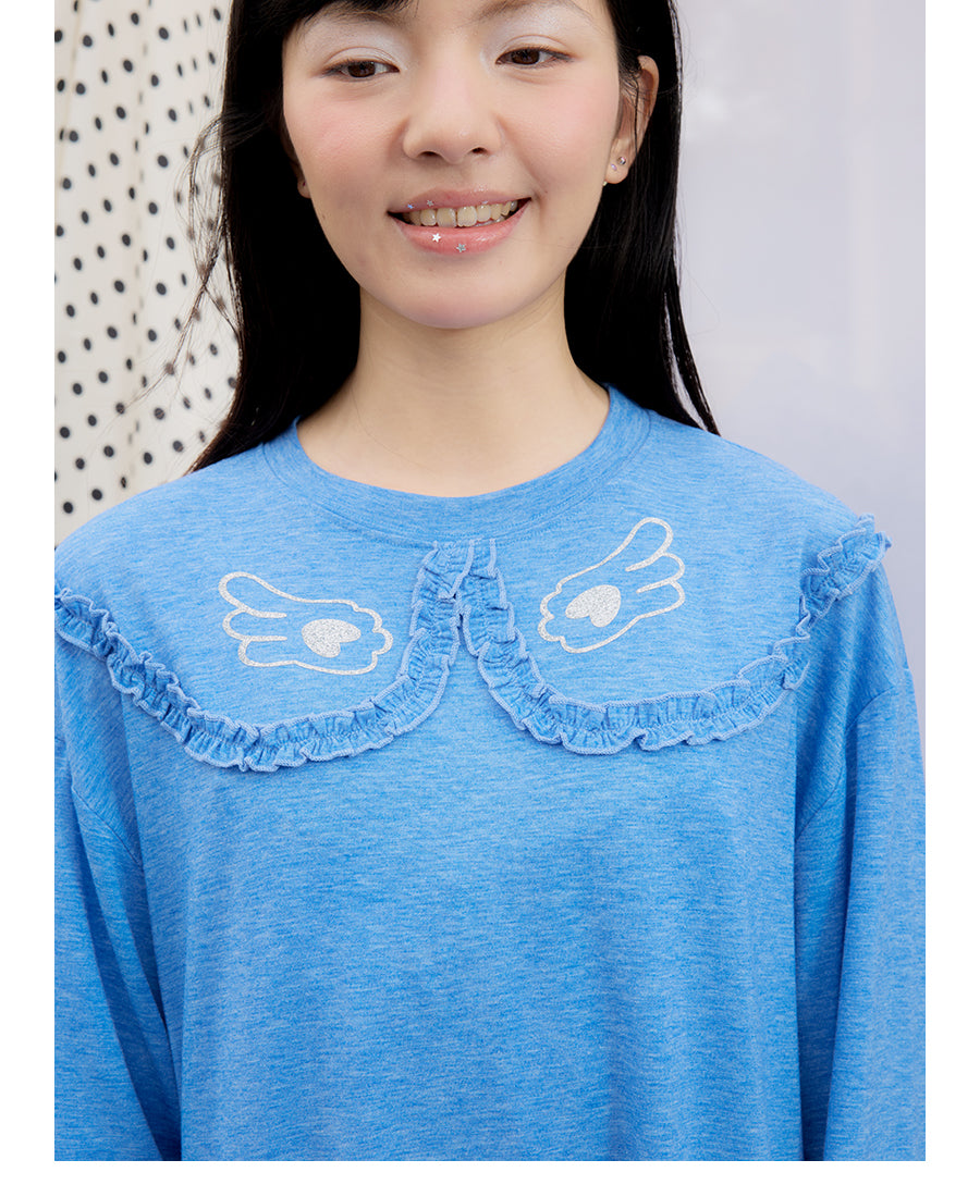 Front view of Unsocial Night blue ruffles tee top featuring a relaxed oversized silhouette, a classic crewneck, long sleeves, and paneled patchwork detailing