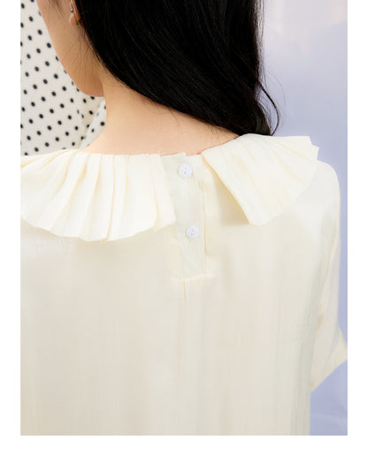 Front view of Unsocial Night beige Shimmer Waves pleated dress featuring an A-line silhouette, classic round neck, half sleeves, and delicate rhinestone embellishments