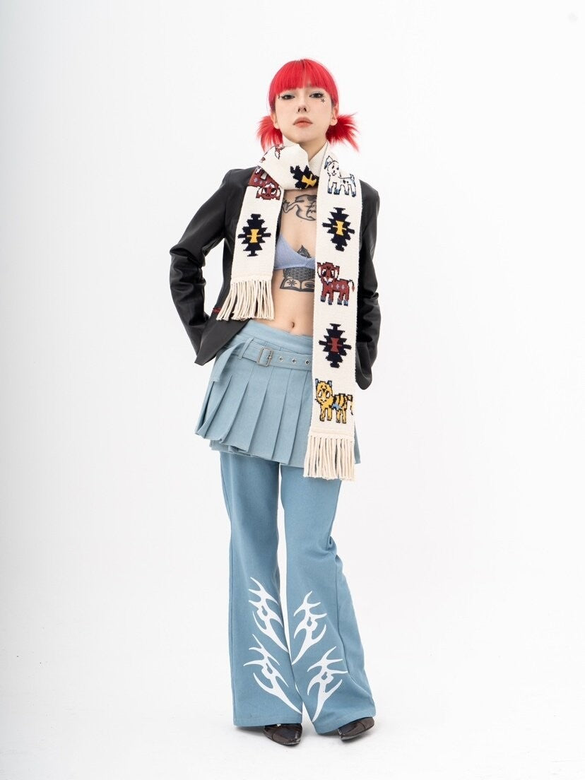 Front view of Unsocial Night illustrated animal knit scarf showcasing the custom jacquard graphic motif, soft ribbed knit texture, and long twisted fringe edges